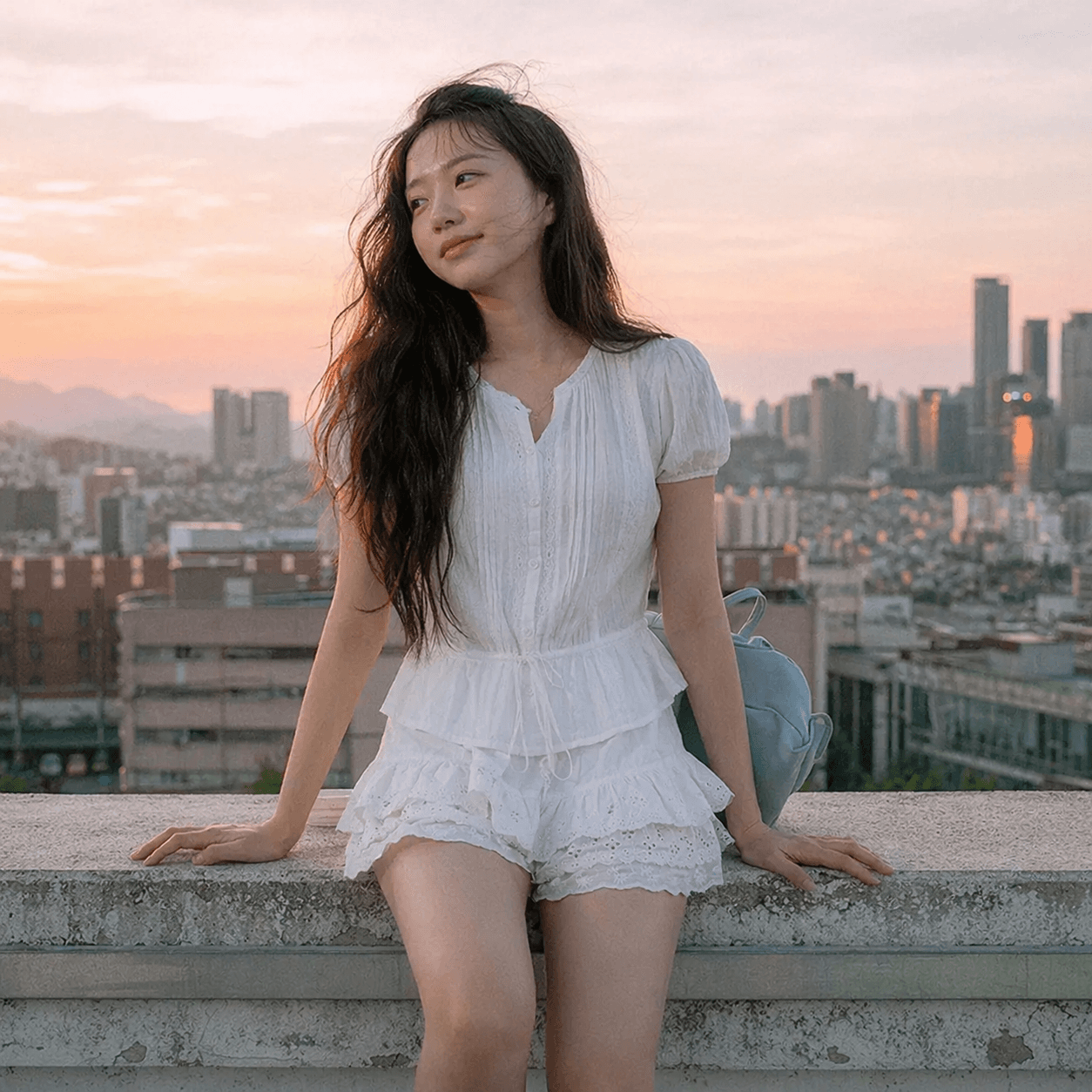 White pintuck blouse with soft spring daytime light